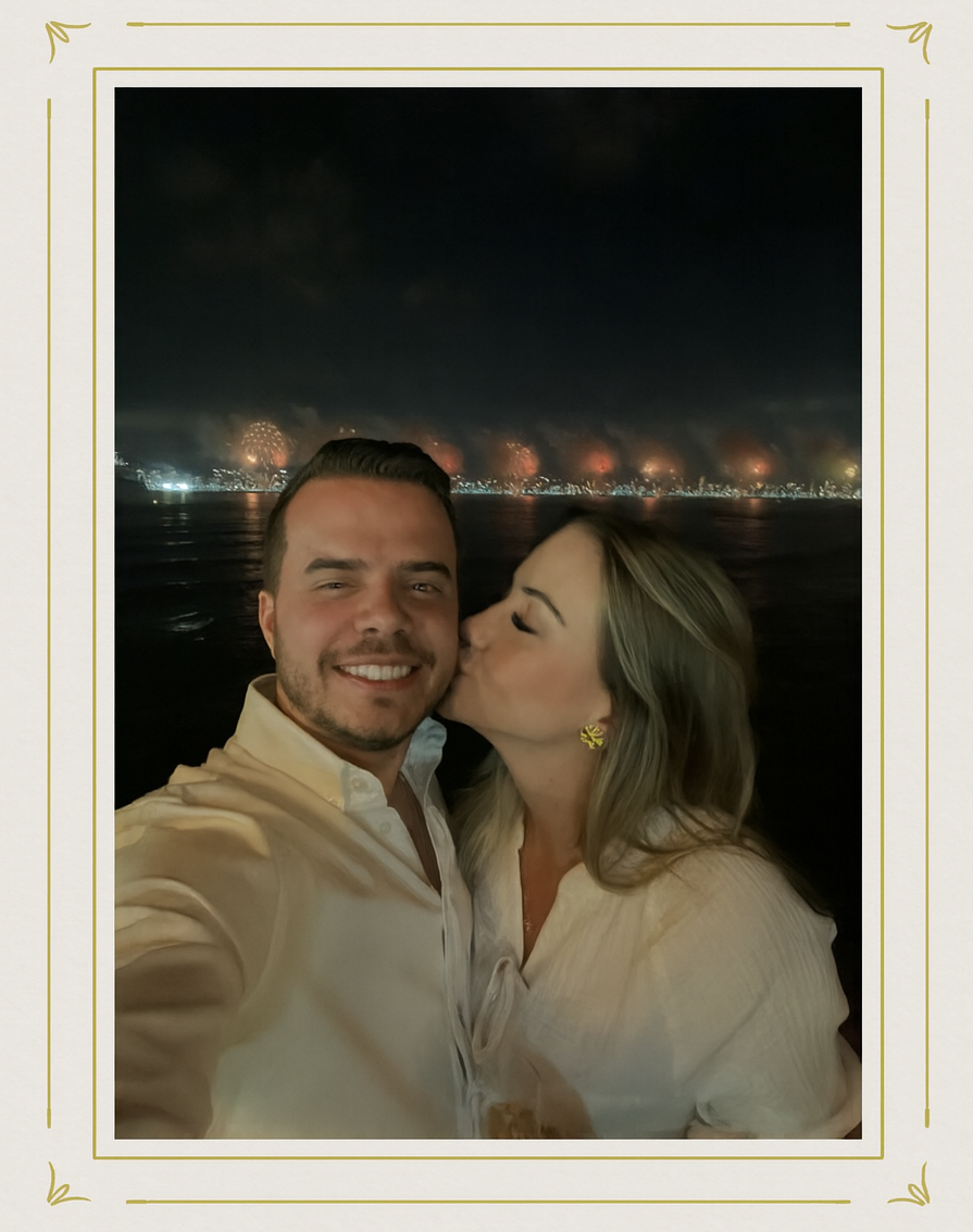 Gabriela kisses Rafael by the water under fireworks